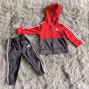 Red and gray two piece adidas jogger set with zipper